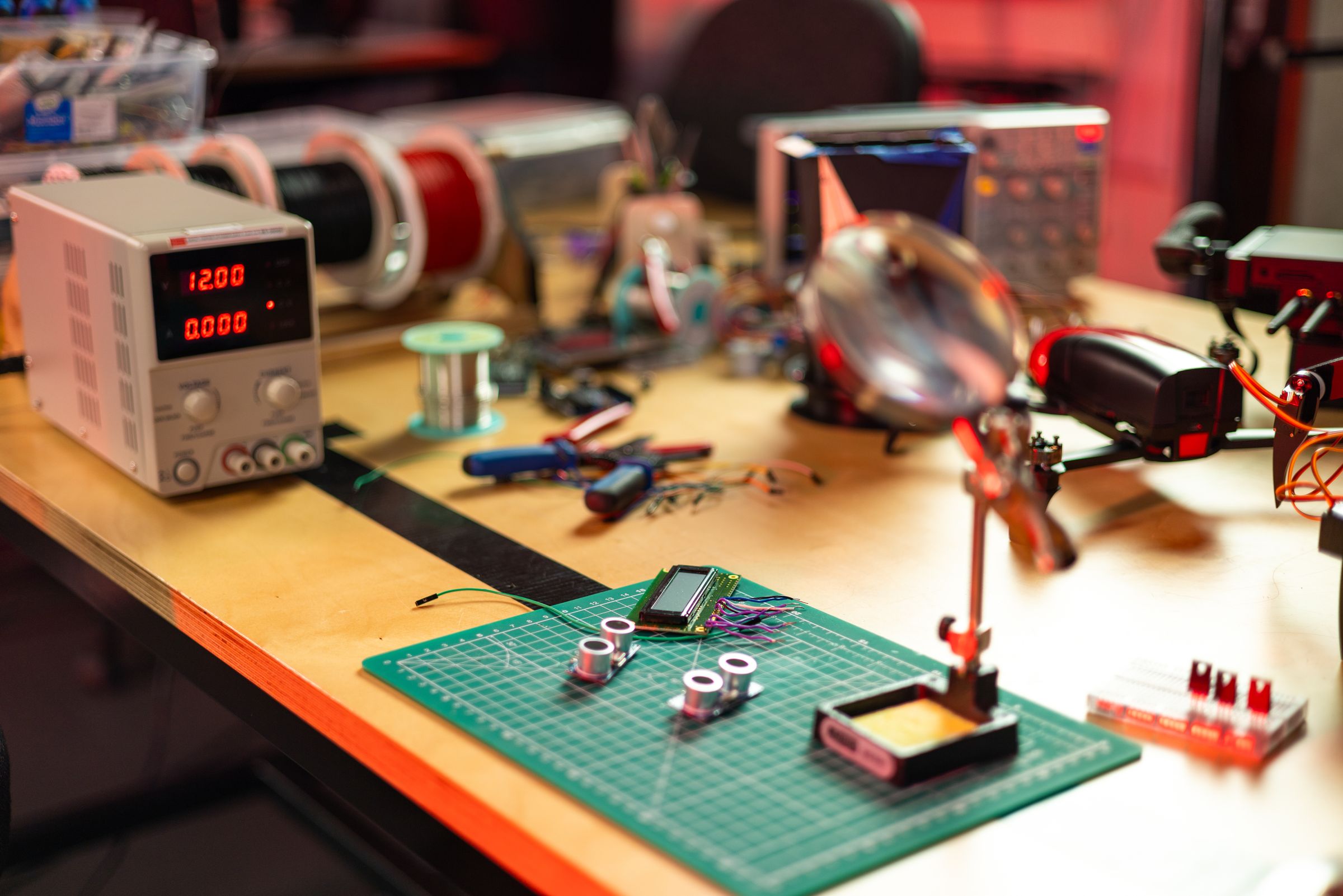 Electronics prototype being assembled and tested on a workbench